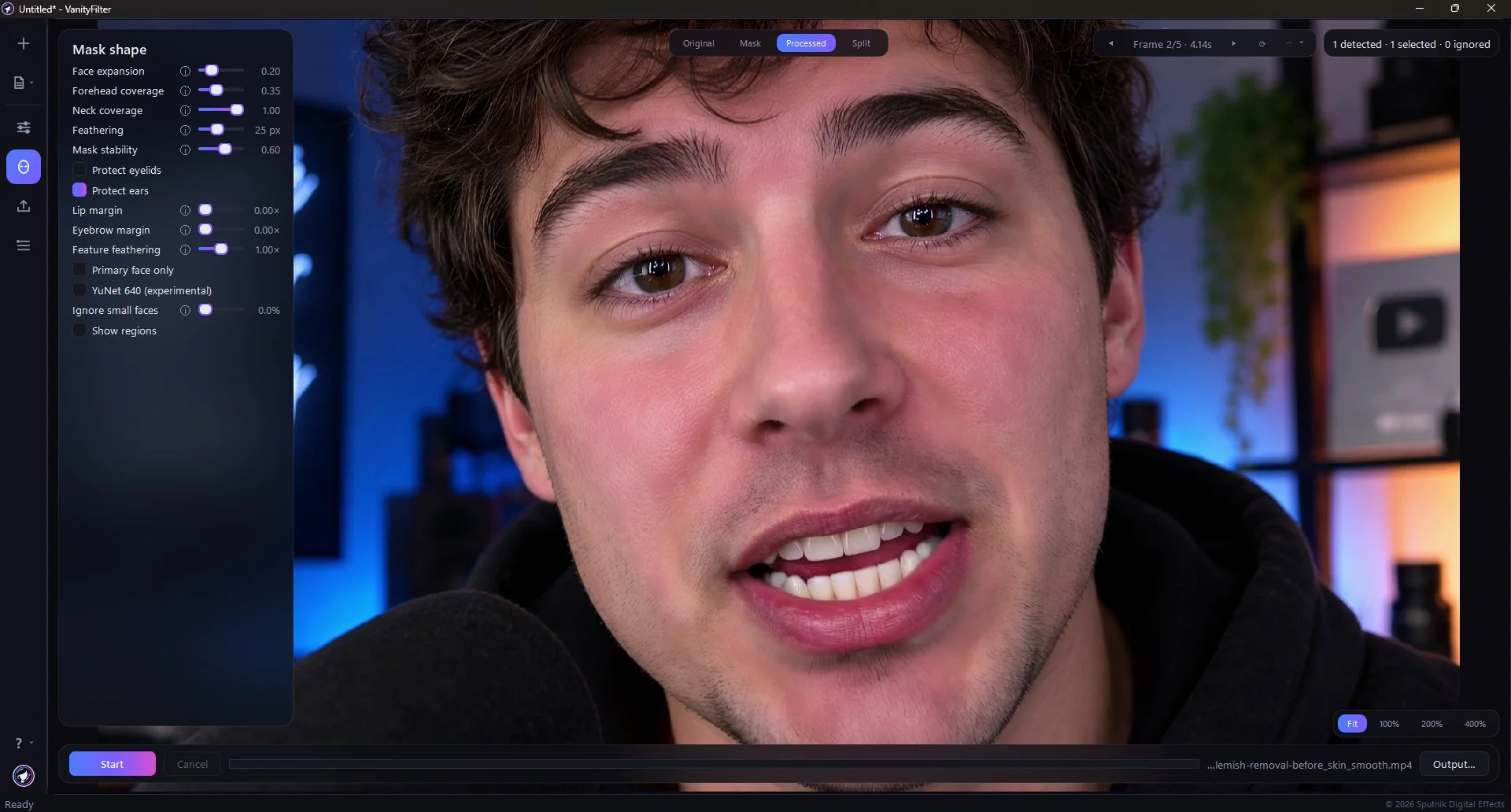 The same frame on the Processed tab, with the skin cleaned up while the hair, hoodie and lit background stay untouched.