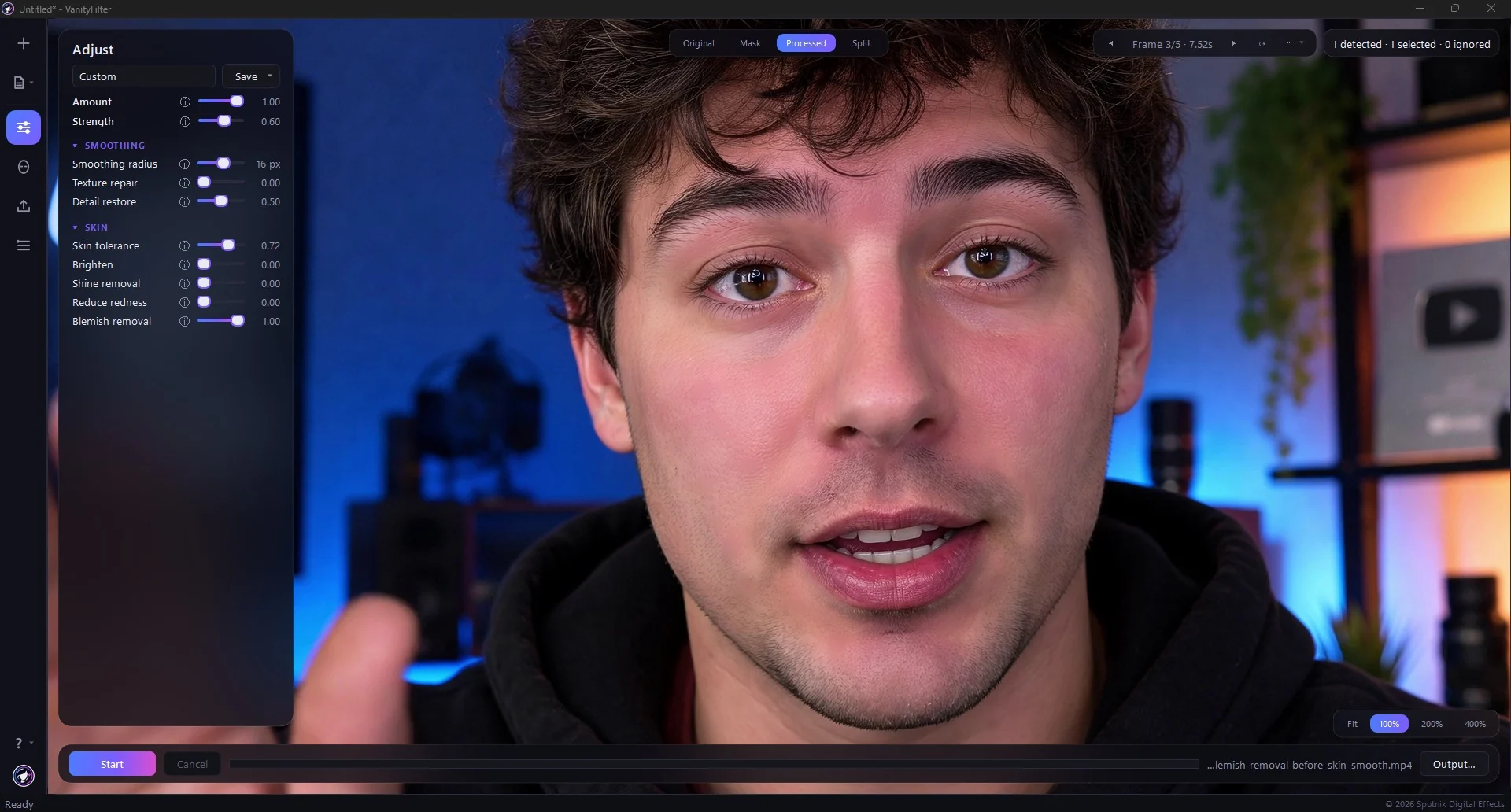 The same frame on the Processed tab, with the skin cleaned up while hair, hoodie and background stay untouched.